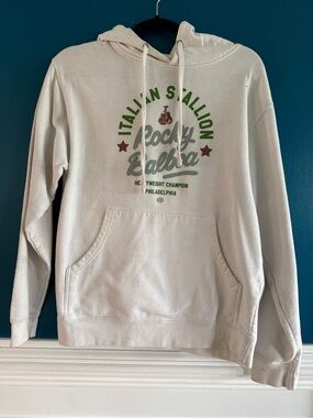 Rocky Cream Hoodie with Green and Brown Chest Graphic - Rocky